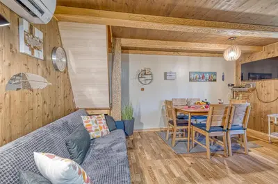 a living room with a couch and a table at Fani's Riverside Cottage - Happy Rentals in Kostel