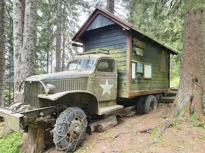 an old truck with a house on the back at A Cottage in the Alps for hiking, cycling, skiing in Jesenice