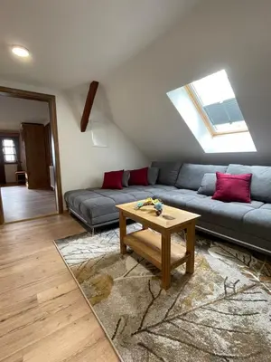 a living room with a couch and a table at Boutique Farm Hrovat in Frankolovo