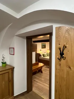 a room with a door leading to a bedroom at Boutique Farm Hrovat in Frankolovo