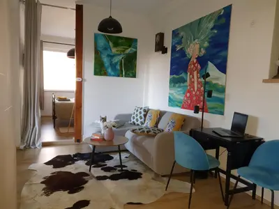 a living room with a couch and a table at Apartment with Terrace Nona Pavla in Tolmin
