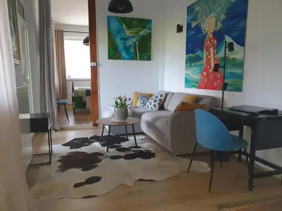 a living room with a couch and a table at Apartment with Terrace Nona Pavla in Tolmin
