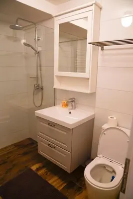 a bathroom with a toilet and a sink and a shower at Kota27 in Bovec