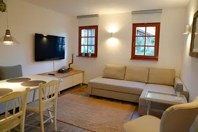 a living room with a couch and a table at Kota27 in Bovec