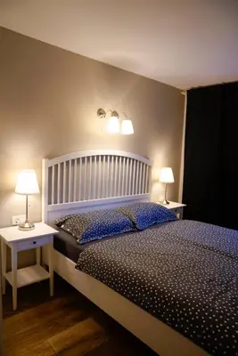 a bedroom with a large bed with two night stands at Kota27 in Bovec