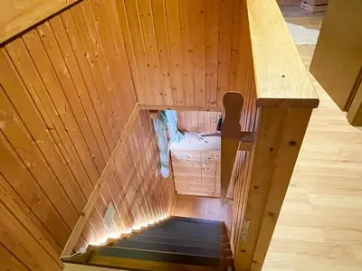 an overhead view of a staircase in a wooden house at Dwarfs cabin overlooking Julian Alps near Bled in Jesenice