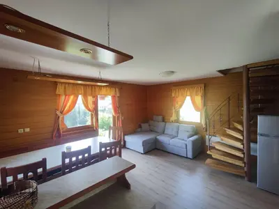 a living room with a couch and a table at Počitniška hišica Rogatec - Holiday Cottage Rogatec in Luče